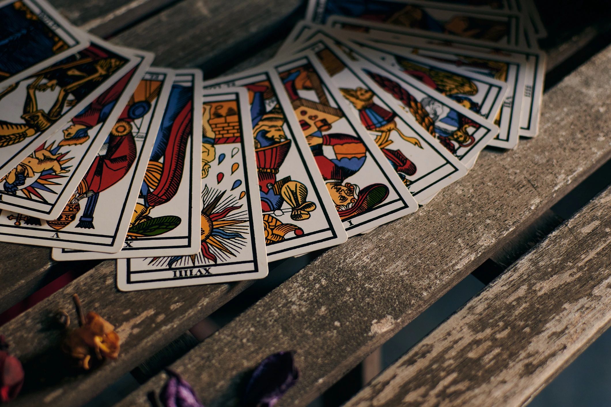Tarot cards arranged on a wooden table